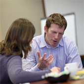 Instructor discussing a subject with a student